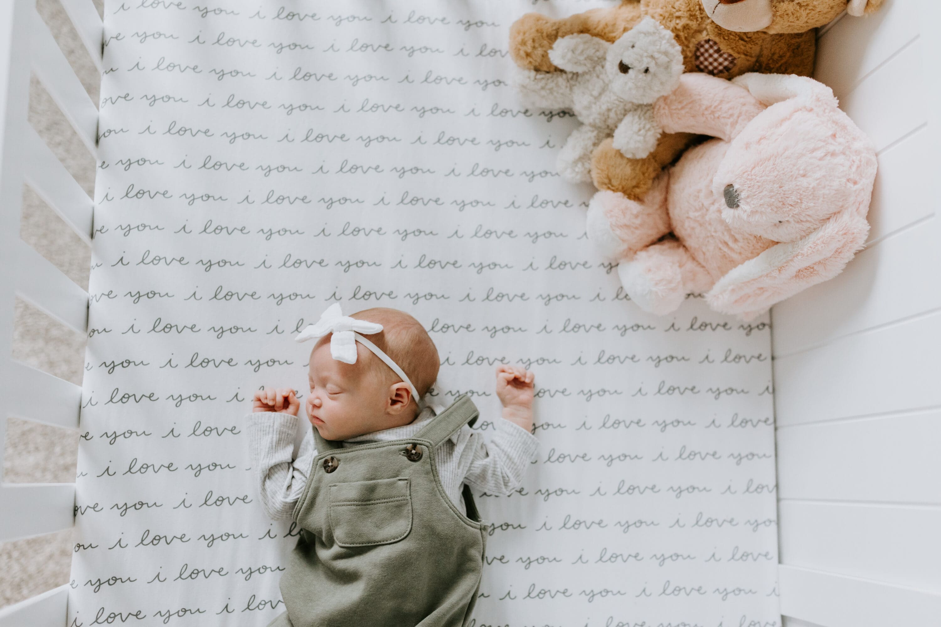 Newborn baby sleeps in her crib