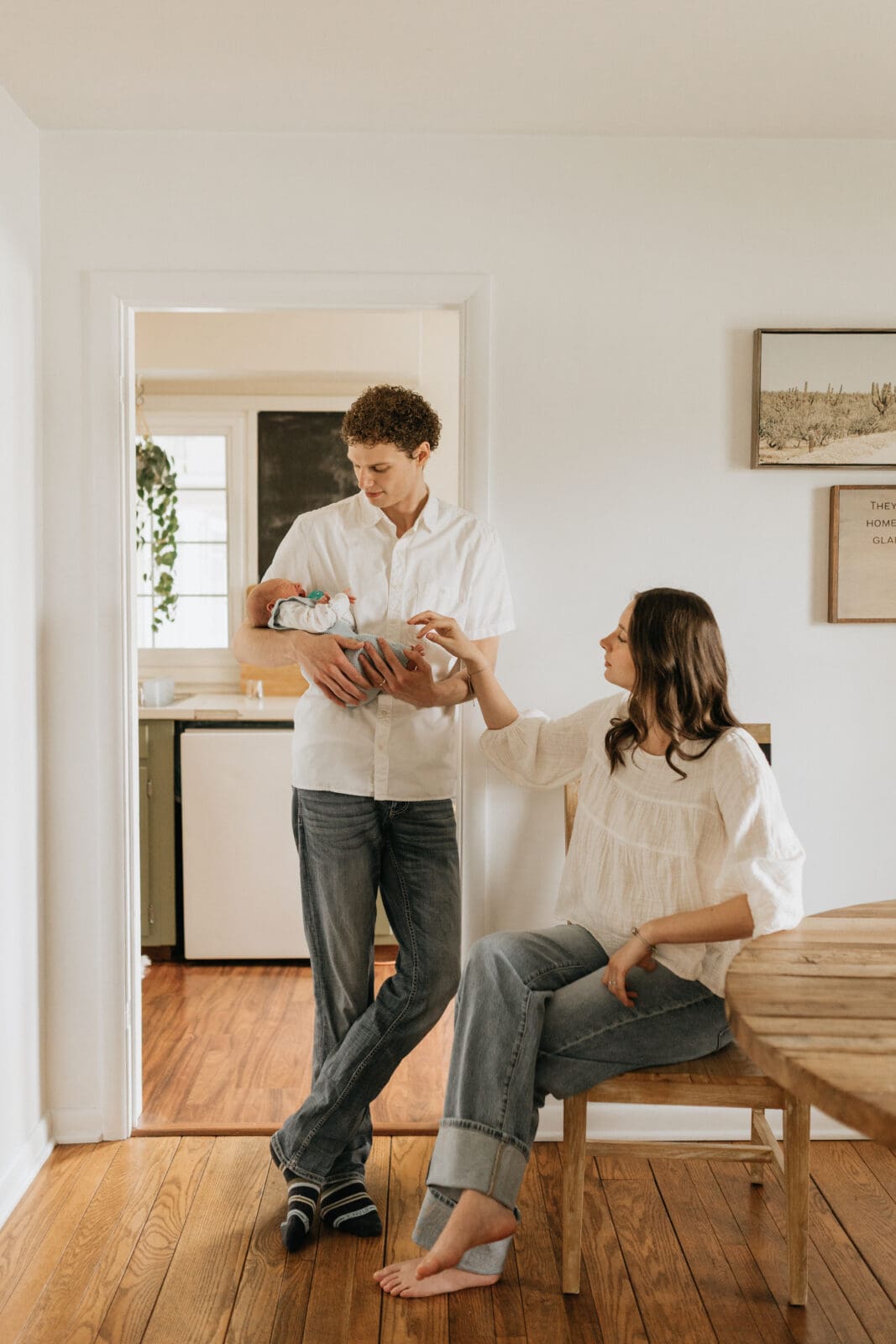 New parents post for newborn photos in Lafayette, Indiana.