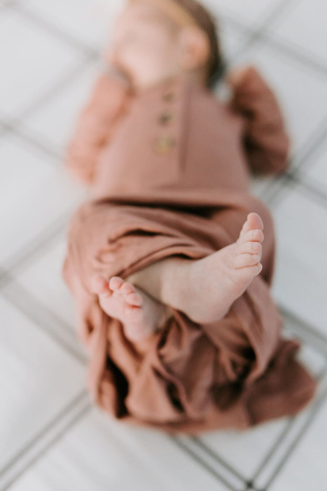 Close up image of a newborn baby girl's feet.